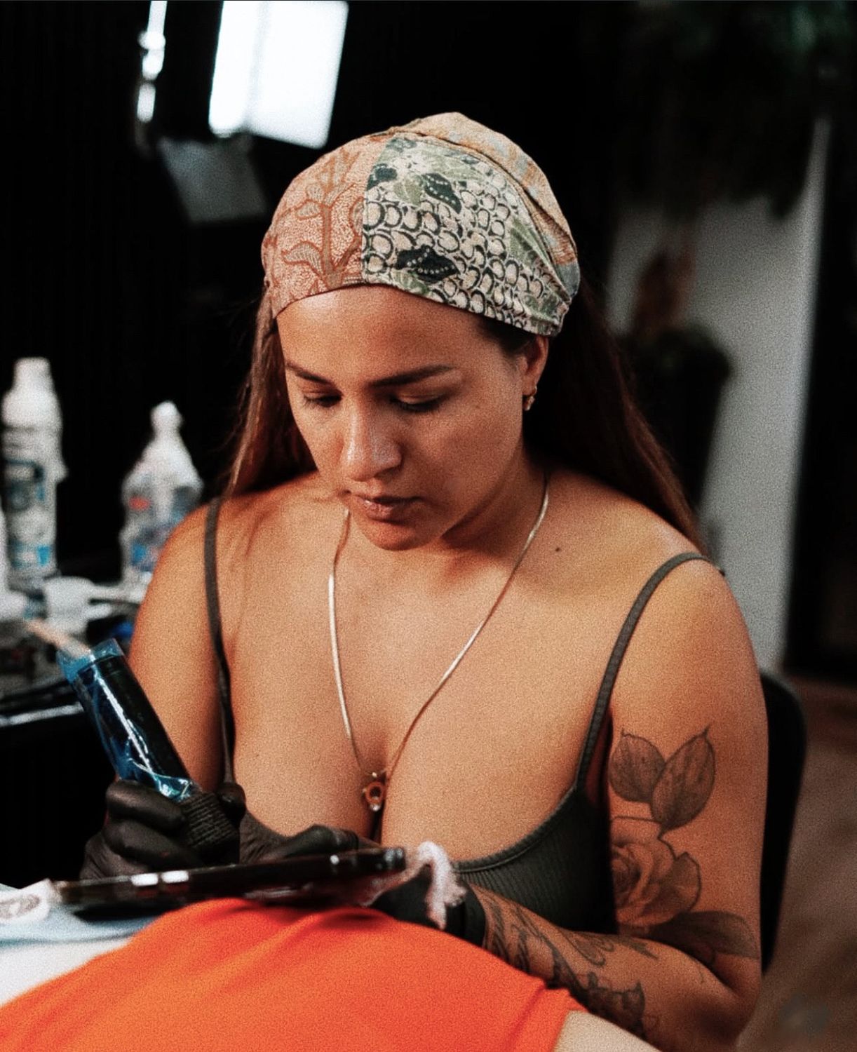 Gigi tattooing in the studio