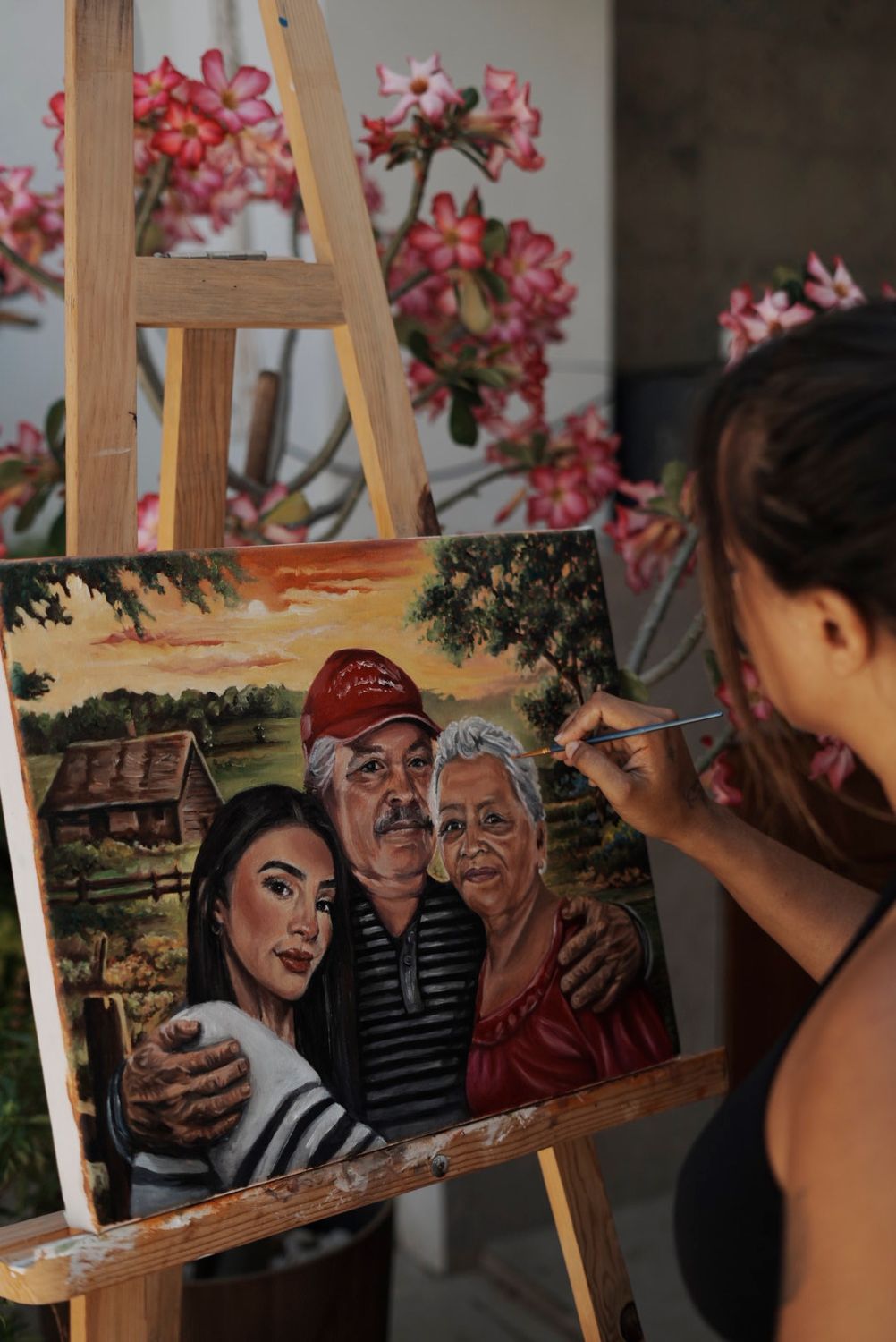 Gigi painting a family portrait in oils