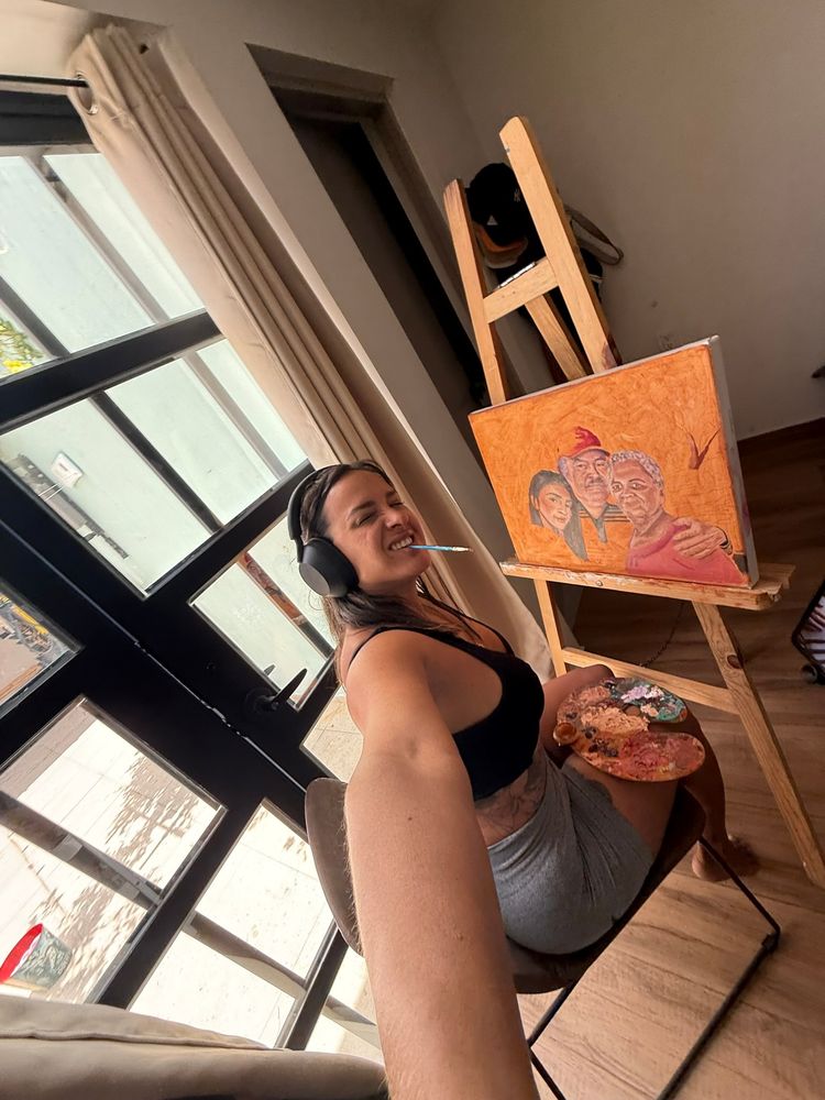 Gigi painting by the window